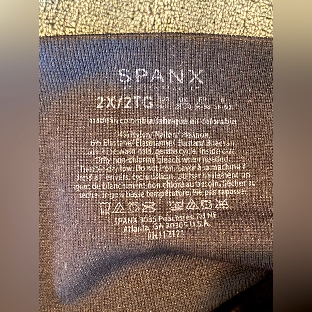 Never worn- coveted Spanx control top black leggings